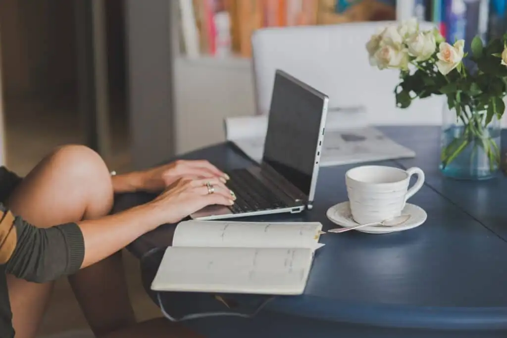 Best strains for studying. Woman sitting at desk with notebook.