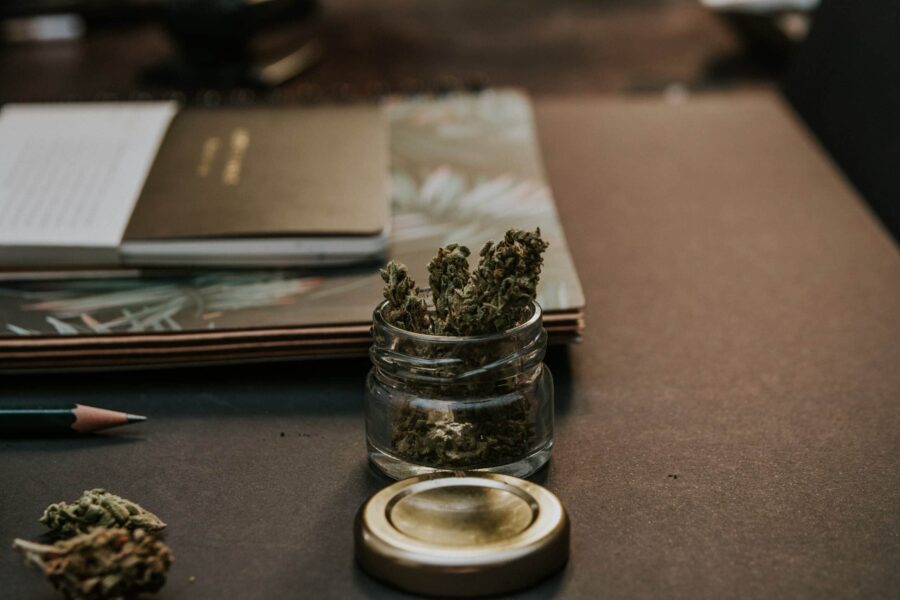 jar of marijuana bud in an office setting